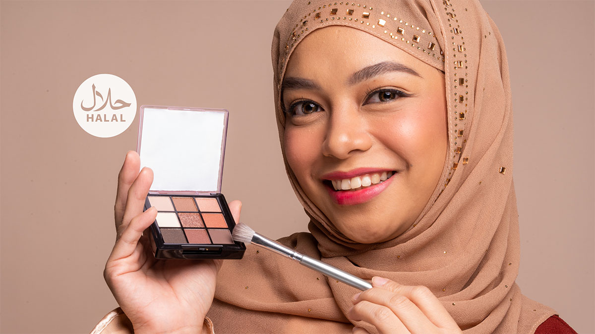 a muslim woman holding a halal beauty product
