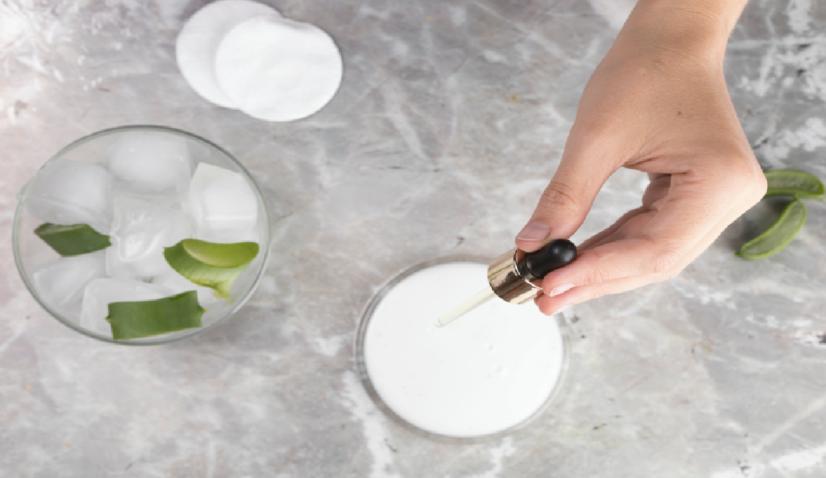 Close up view hand holding pipette