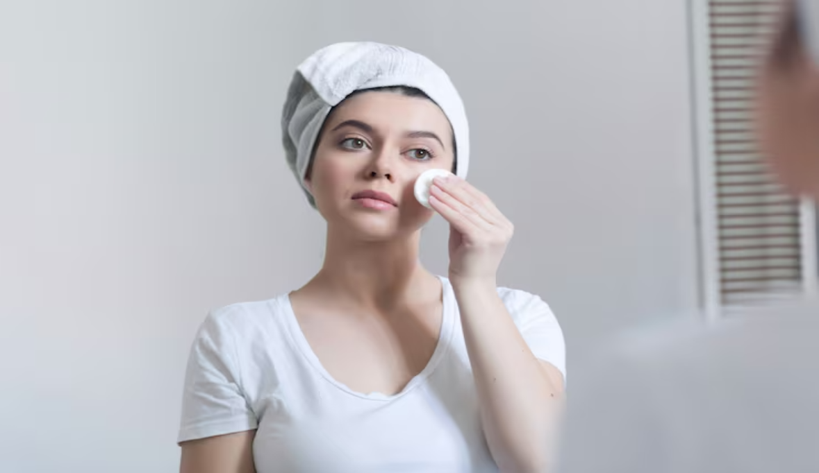 Woman caring her skin face standing near mirror