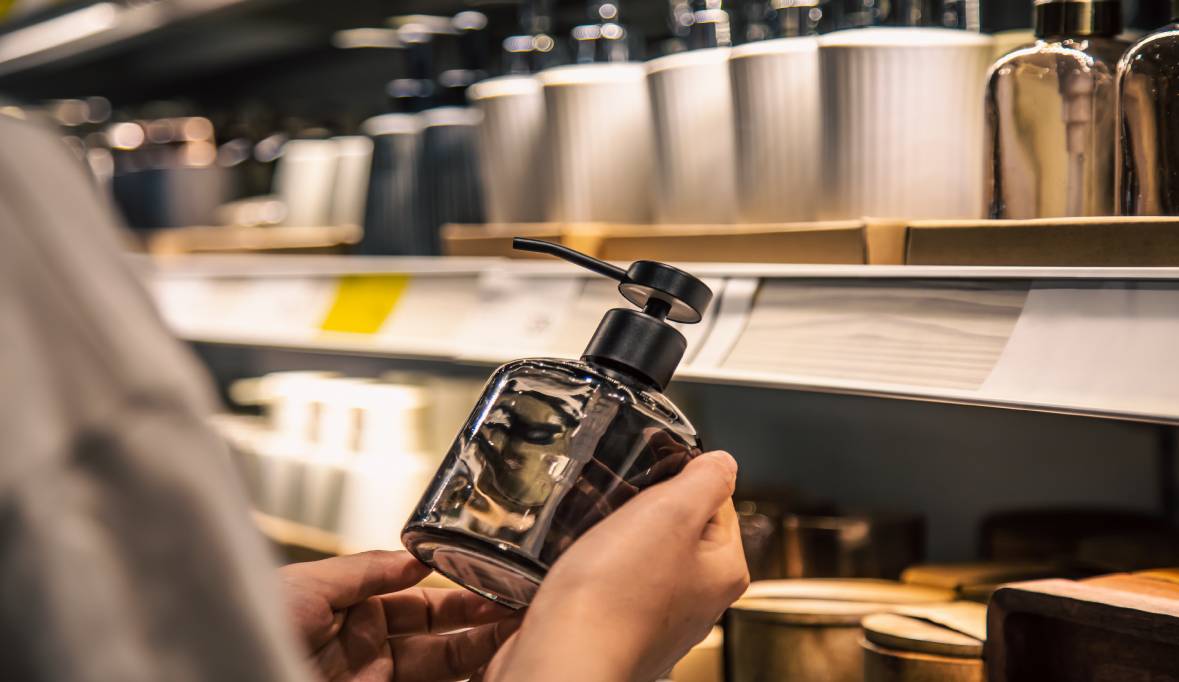 Close up dispenser liquid soap female hands store