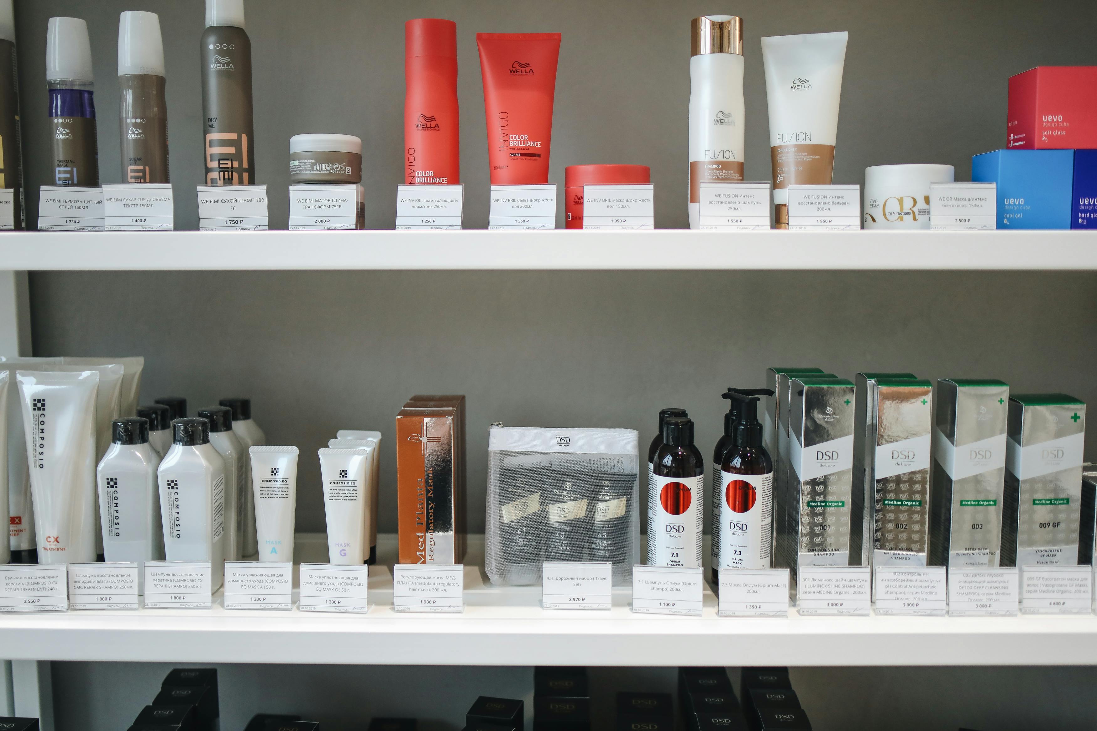Shelves filled with various haircare products, including shampoo bottles and conditioners, and creams