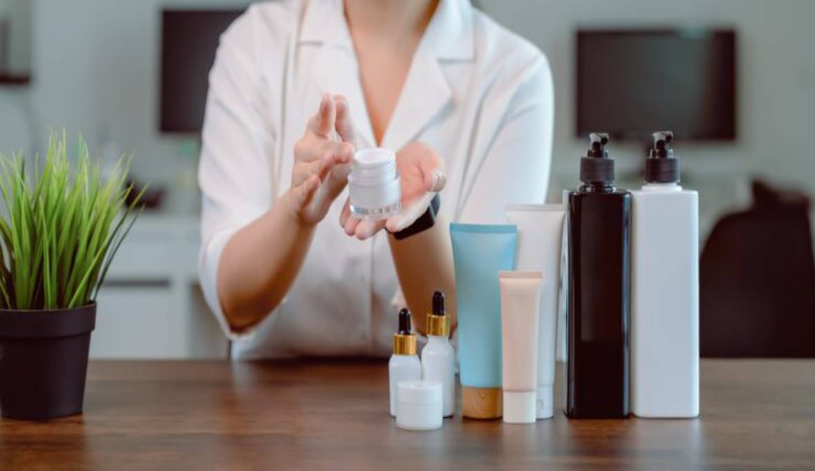 Woman is showing make up cosmetics products live video digital digital camera