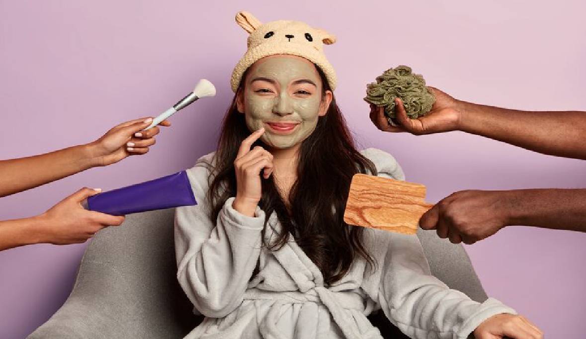 Young beautiful asian woman wears moisturizing face mask dressed comfortable