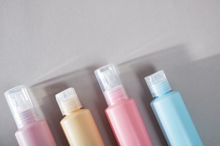 Four plastic bottles cosmetic products