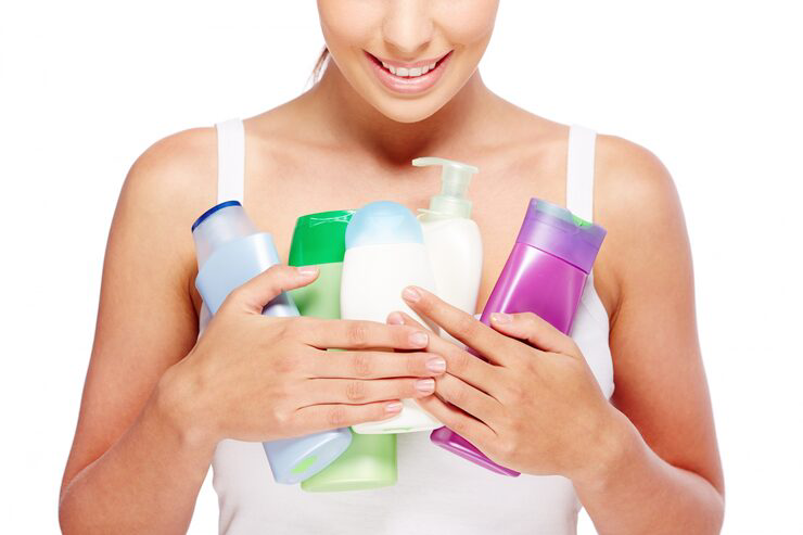 Woman holding different lotions
